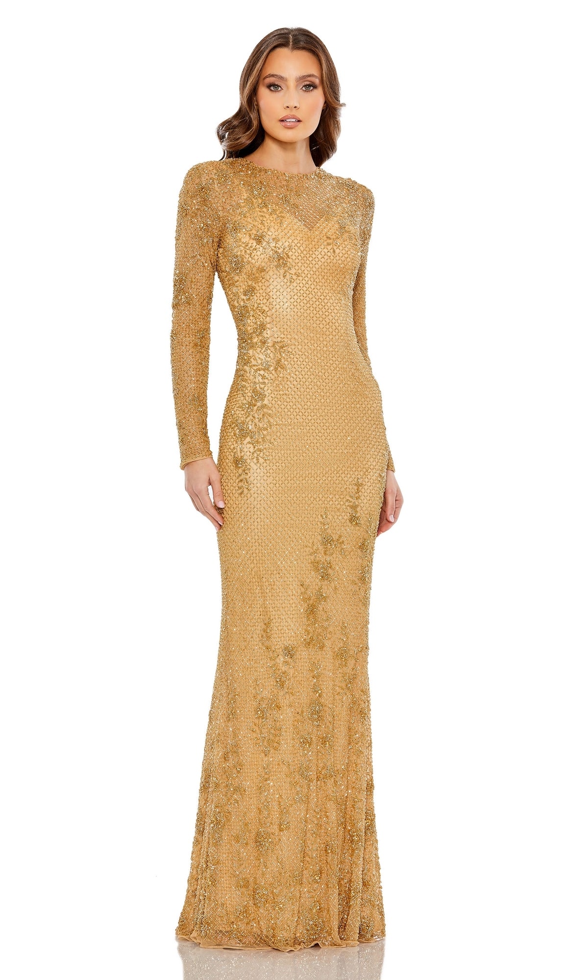 A woman stands against a white background wearing the Mac Duggal 5504 Long Gold Beaded Formal Gown.